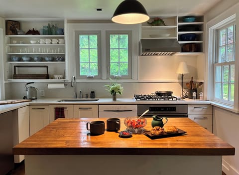 Full kitchen with every pot, pan, dish, utensil, appliance to whip up a feast.