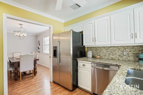 Full kitchen with all the essentials plus dishwasher and door to the patio