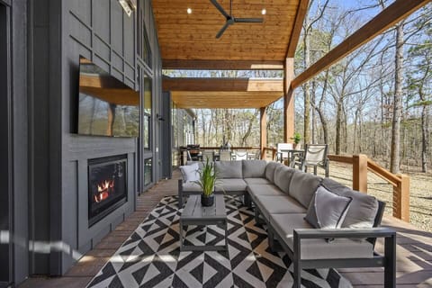 Outdoor seating with fireplace and tv
