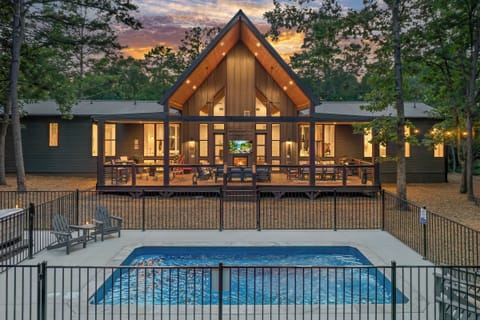 Exterior Oasis: Dive into luxury with a private pool and stunning views of the woods!