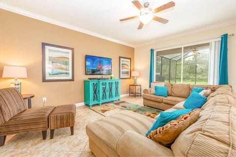 Relax in the living room with comfortable seating and Smart TV.