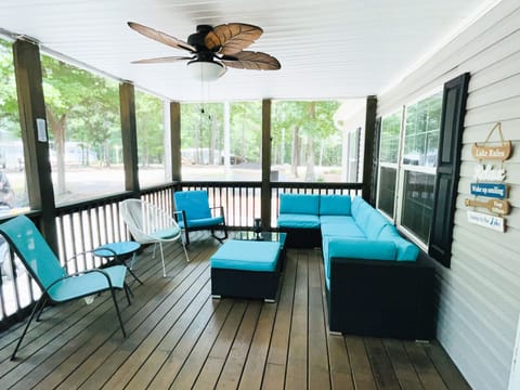 Make memories on the screened in porch with plenty of seating and a fan