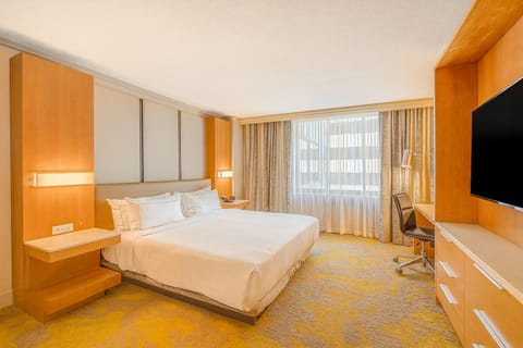 Relax after sightseeing in a calm, sunlit bedroom.