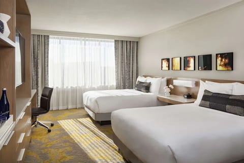 Unwind in bright, airy comfort with two plush beds.