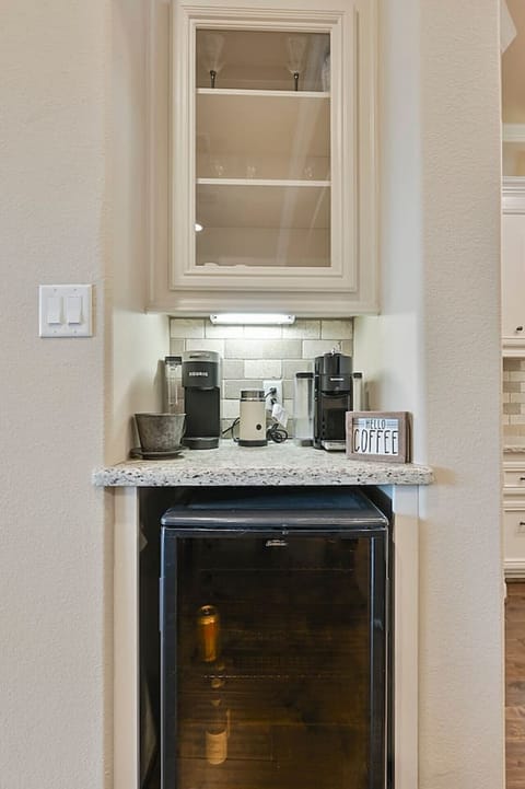 The kitchen also offers a coffee bar along with a wine fridge