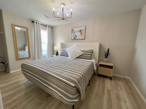 Main floor king bedroom with full private bath