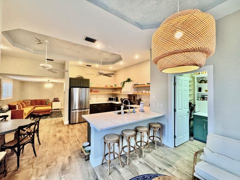 kitchen with dining and a view to the pantry and living room