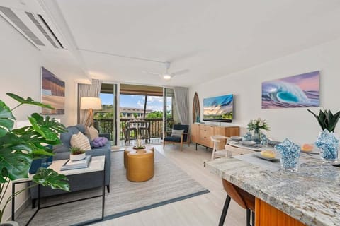 Enjoy a comfortable seating area with chic décor and plenty of sunlight streaming through large glass doors