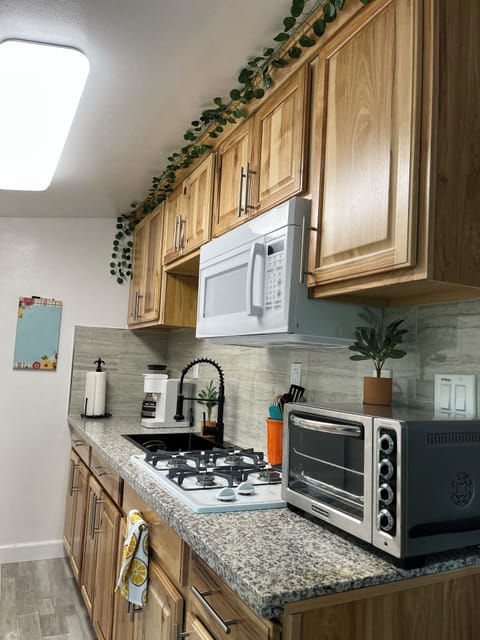 a very complete kitchen: stovetop, toaster oven, fridge and a…keurig for coffee 