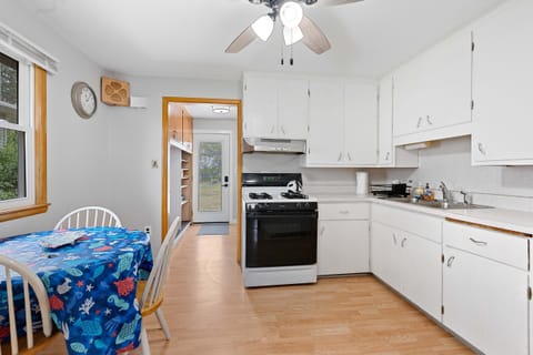 Quaint kitchen has everything you need for any length of stay with on kitchen dining nook.