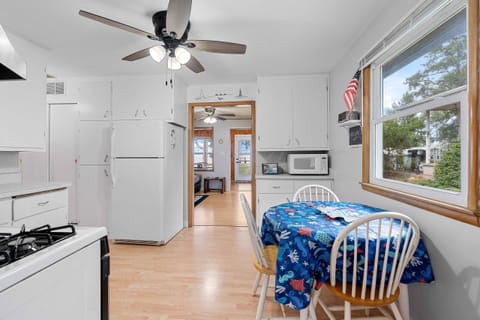 Quaint kitchen has everything you need for any length of stay with on kitchen dining nook.