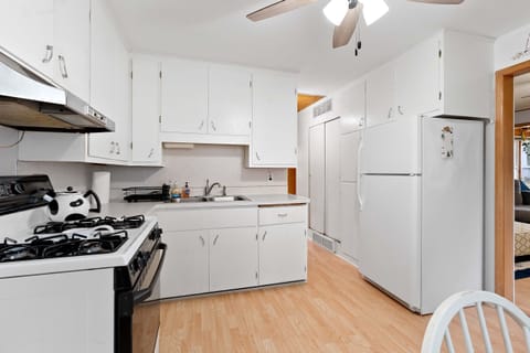 Quaint kitchen has everything you need for any length of stay with on kitchen dining nook.