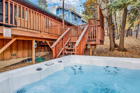 Relax in the outdoor hot tub area, a cozy and peaceful space perfect for unwinding and enjoying fresh air after a long day.