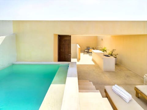 Private rooftop with pool and sunbeds—your Tulum oasis awaits.