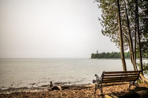 Enjoy picturesque views of the Cana Island Lighthouse from your private beach!