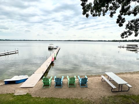 Lakeside view with private beach, chairs, and 
picnic table