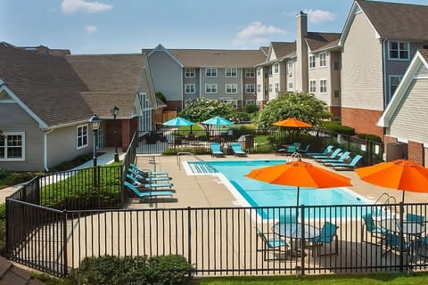 Dive into sunny pool days with loungers and umbrellas