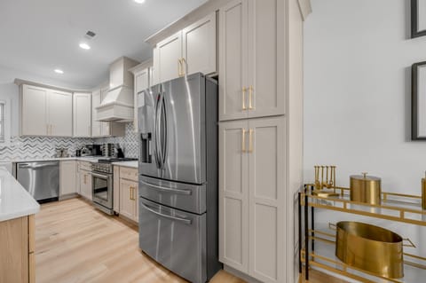 Fully equipped modern kitchen featuring stainless steel appliances, ample counter space, and everything you need to cook, dine, and entertain with ease.