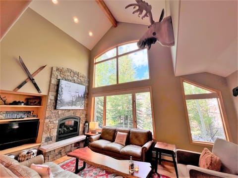 Great room with floor to ceiling windows and plenty of comfy seating