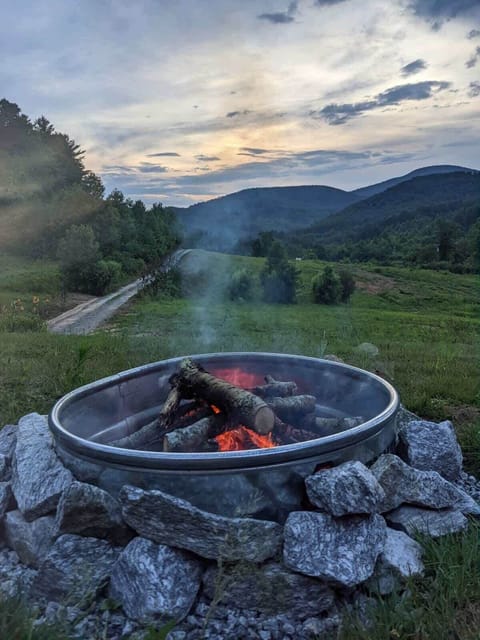 Enjoy the mountain view while sitting by the fire pit.