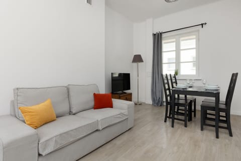 Living room with a comfortable sofa and TV.
