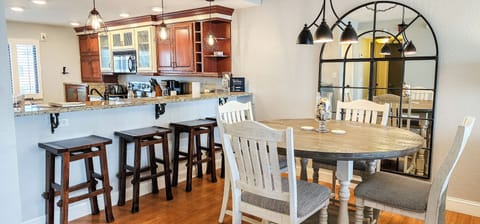 Seating for 8 (4 at table with 4 extra bar stools at counter)