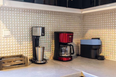 Kitchen Amenities – Coffee maker, toaster, and all essentials for daily convenience.
