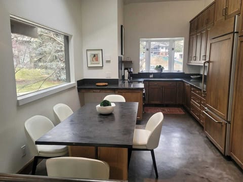 Dining table looking into the kitchen