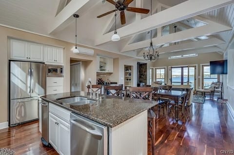 Between the kitchen and dining is a pantry, powder room and linen closet.