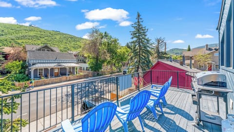 - Balcony with mountain views and blue Adirondack chairs  
- Outdoor grill for easy dining with scenic backdrop  
- Relax in fresh air while enjoying Park City charm