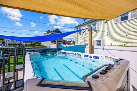 Relax in our 16-ft Dual-Temp Swim Spa with Hot Tub! This spa offers a refreshing swim spa on one side for exercise or cooling off, and a soothing hot tub on the other for ultimate relaxation.