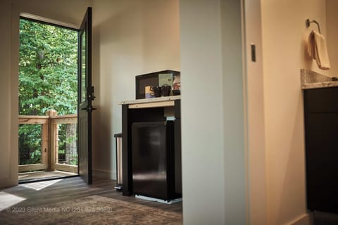 Kitchenette stocked with a compact refrigerator and microwave!