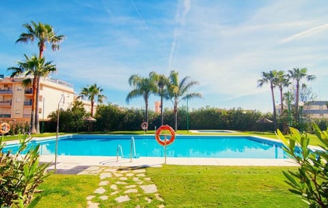 Communal swimming pool and children pool surrounded by gardens