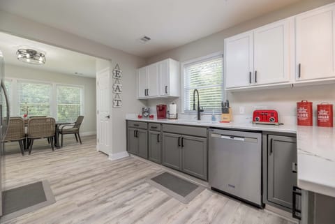 Open kitchen leads right into the dining room with seating for 6. 
