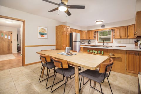 Kitchen updated for 2024 with stainless appliances, lighting, and countertop. 