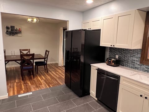 Kitchen open to Living area and Dining area.