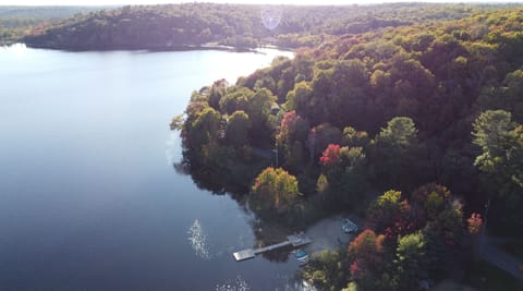 Waterfront beach lot with dock, water toys, watercraft and gazebo. 