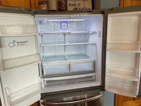 French door refrigerator with adjustable shelves perfect for entertaining.