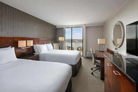 Wake up to skyline views from this airy double-queen room.