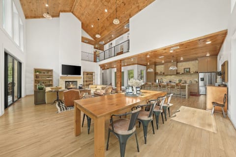Dining Room: Enjoy memorable meals with stunning forest views through floor-to-ceiling windows!