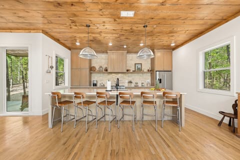 Kitchen: Sleek design and natural light unite for delightful cooking and memorable meals!
