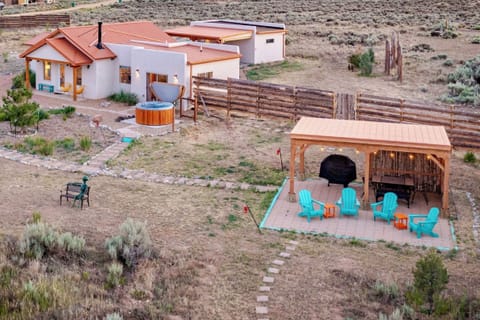 Enjoy outdoor dining in this pergola equipped with a 4-burner propane grill. Dining table sits 6 plus 4 Adirondack chairs to take the views in. 