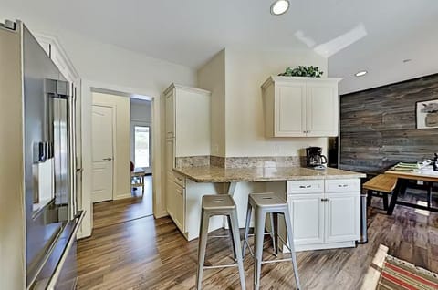 Bar-style seating at the kitchen counter.