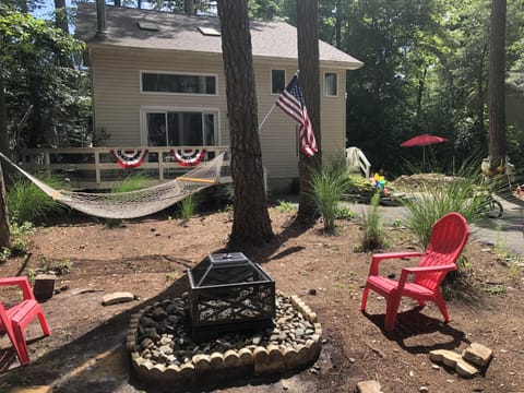 view from front yard towards house showing firepite