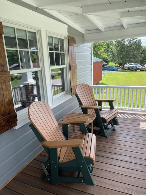 Rocking chairs on front porch. 