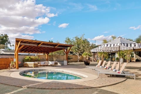 Our huge backyard offers a heated pool with plenty of loungers and umbrellas.