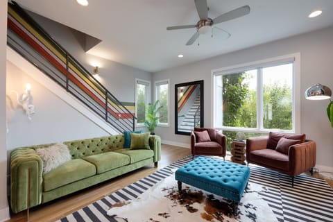 2nd Floor: Eccentrically designed living space featuring designer furnishings, retro arcade games, and a flat-screen Smart TV for entertainment.