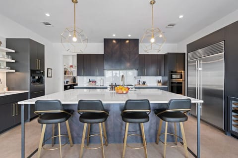 A fully equipped kitchen featuring a spacious island counter, perfect for cooking and gathering.