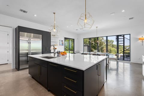 Modern kitchen with all the essentials and a large island for meal prep and entertaining.
