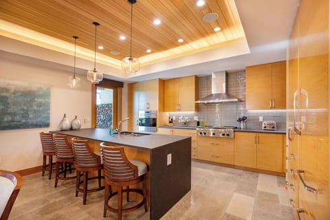 Wide and spacious kitchen with room for entertainment while crafting delightful meals.